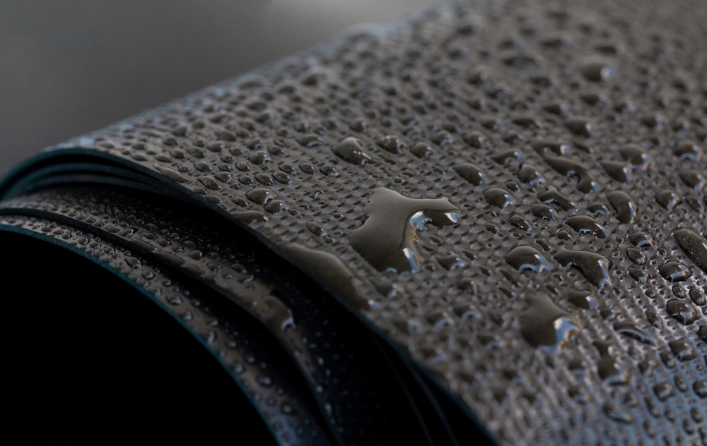 Water,Droplets,On,The,Rubber,Membrane.,Waterproofing...,Close-up,Selective,Focus